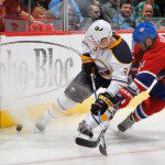 Gomez battles for puck